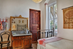 bedroom No.2 with washbasin and antique iron bed (includes AC)