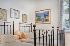 bedroom  No.5  with two antique iron beds - wooden chest of drawers -wardrobe