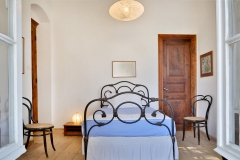 bedroom  No.6 with antique iron bed - wooden chest of drawers -wardrobe