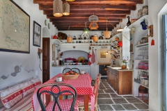 traditional kitchen with wooden ceiling and stone floor