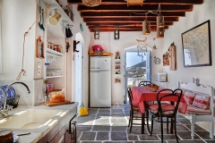 traditional kitchen with wooden ceiling and stone floor
